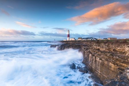 The temporal clustering of storm surge, wave height and high sea level exceedances around the UK coastline